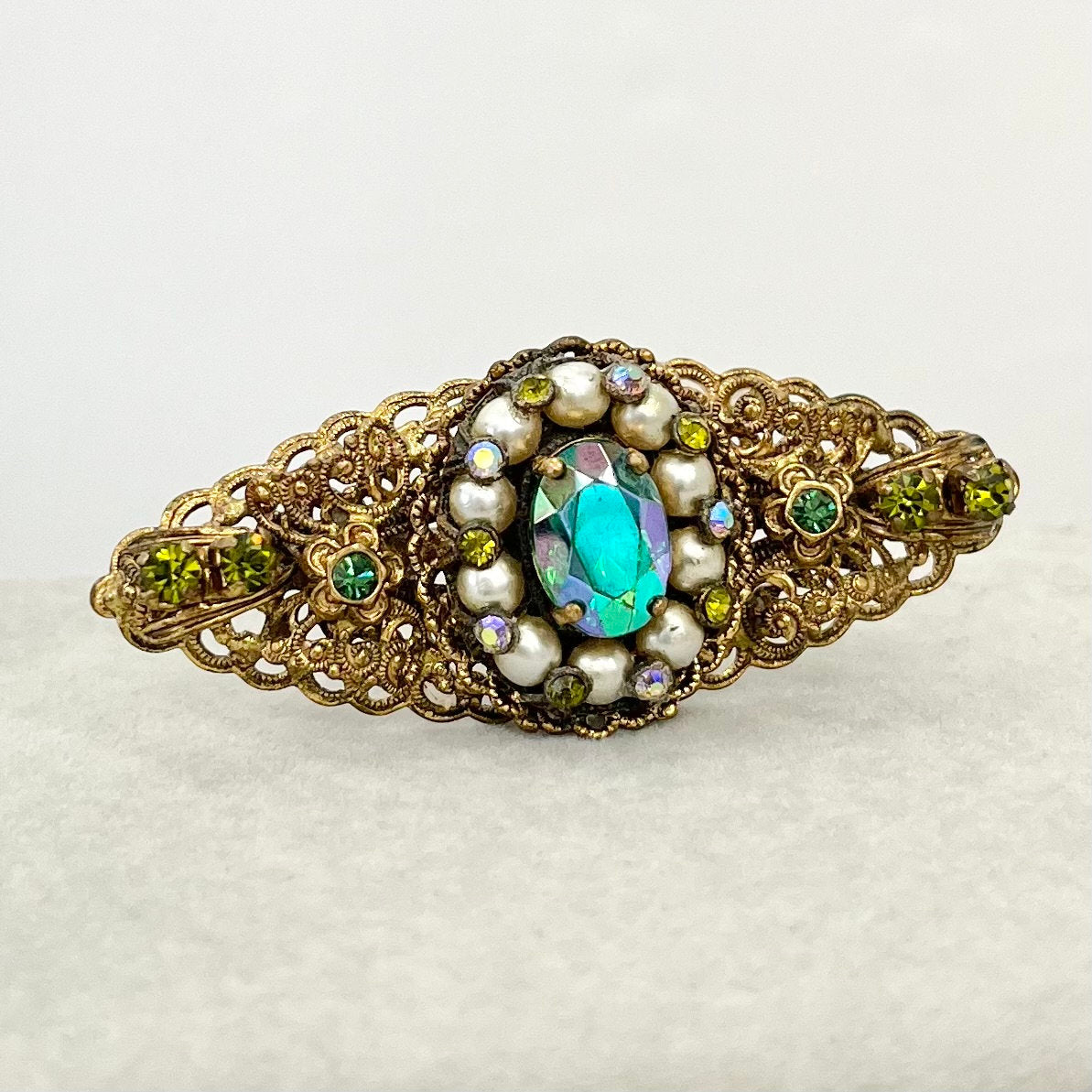 Antique Green Crystal Brooch in a Brass Stamping Filigree Setting Beautifully Made Vintage Brooch TheGreenGlassGemShop