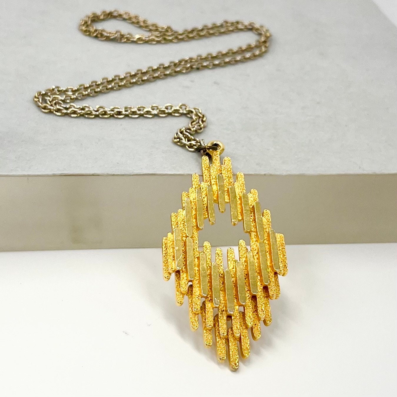 Vintage 1970‘s Gold Plate Brutalist Pendant Necklace in a Layered Diamond Shape Design with a 27” Chain TheGreenGlassGemShop