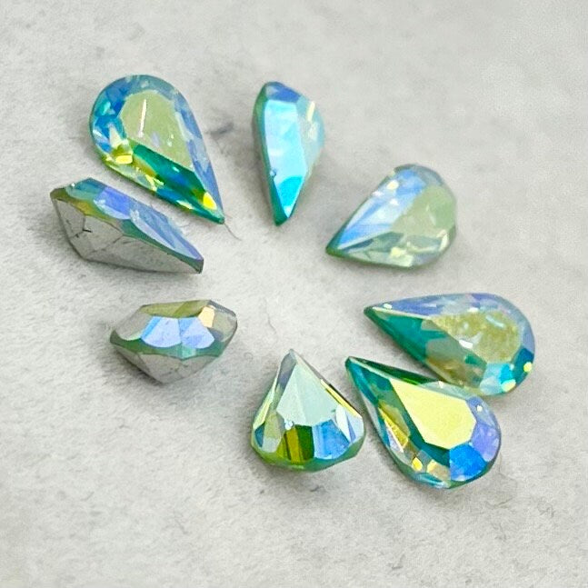 Pack of 8 Rare Uranium Vaseline Glass Swarovski Crystals Faceted AB Pear Cut 6x10mm Rare Cut TheGreenGlassGemShop