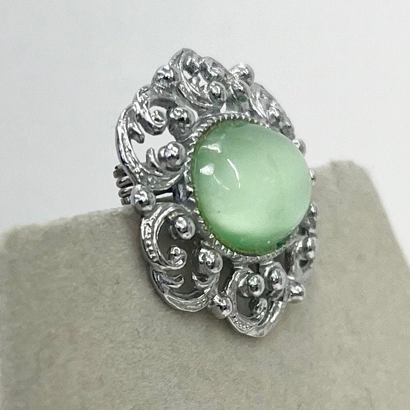 Vintage Silver Tone Mint Green Czech Glass Brooch with a Scrolled Filigree Surround TheGreenGlassGemShop