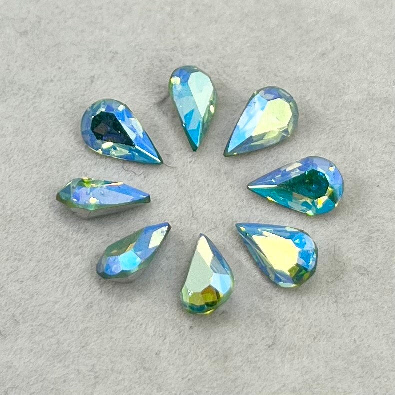 Pack of 8 Rare Uranium Vaseline Glass Swarovski Crystals Faceted AB Pear Cut 6x10mm Rare Cut TheGreenGlassGemShop