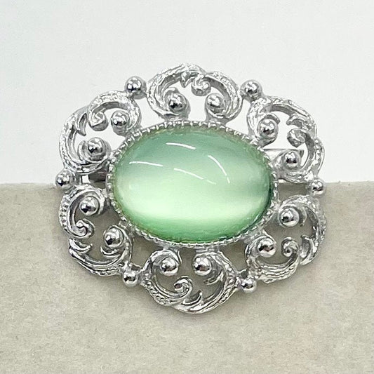 Vintage Silver Tone Mint Green Czech Glass Brooch with a Scrolled Filigree Surround TheGreenGlassGemShop