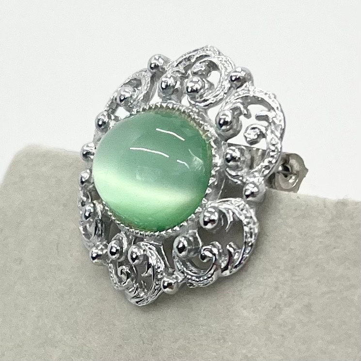 Vintage Silver Tone Mint Green Czech Glass Brooch with a Scrolled Filigree Surround TheGreenGlassGemShop