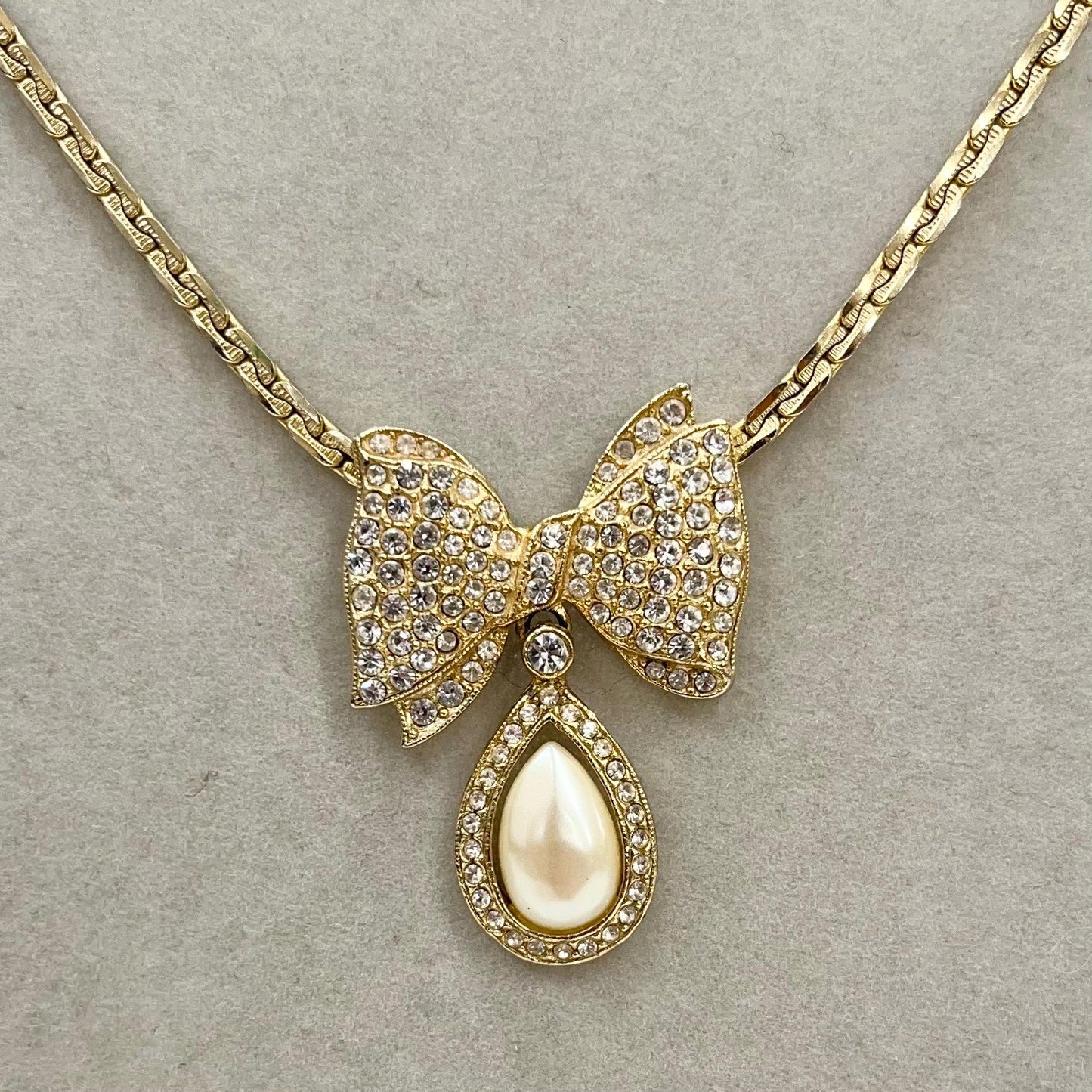 Vintage Gold Plated Diamante Bow Necklace with a Teardrop Faux Pearl Drop TheGreenGlassGemShop