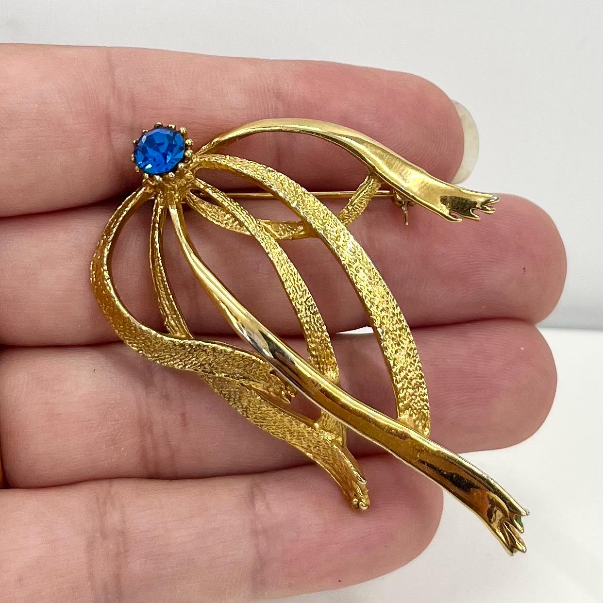 Vintage Hollywood Gold Tone Brutalist Ribbon Brooch with Blue Crystal Accents Contempory Costume Jewellery Statement Piece TheGreenGlassGemShop